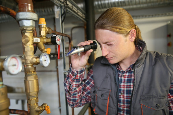 Technician Checking Water Quality in Hydronic System